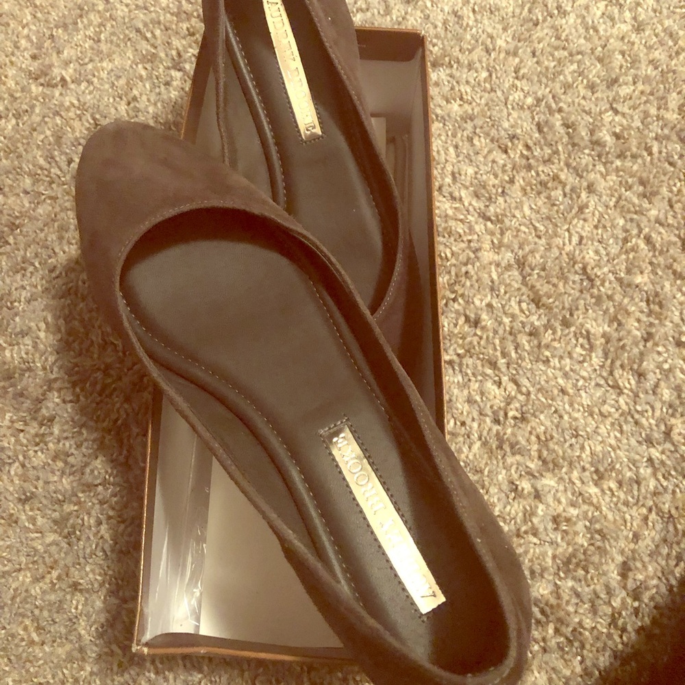 A pair of lightly worn Audrey Brooke flats